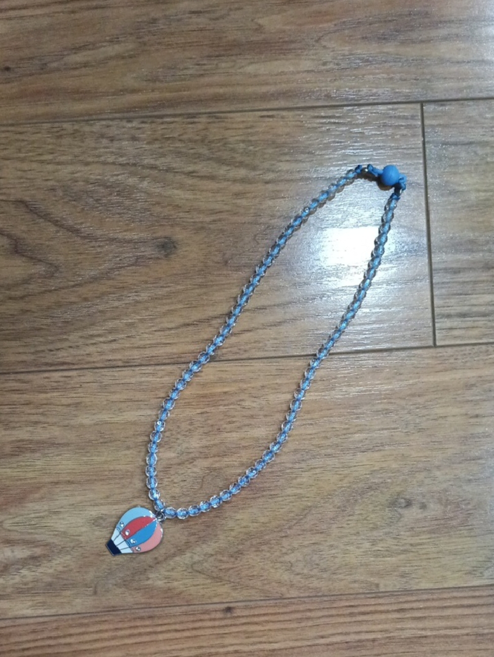 Source Unknown Blue Beaded Necklace with Red and White Hot Air Balloon Charm